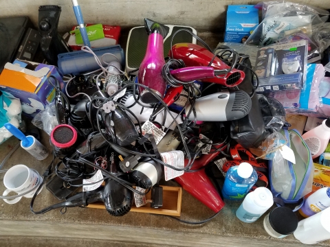 A pile of hair dryers