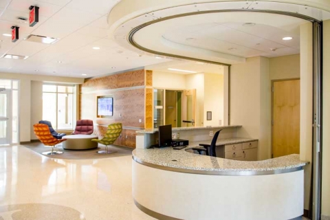 Wassaja Hall's Front Desk in the foregroud and some study areas in the background