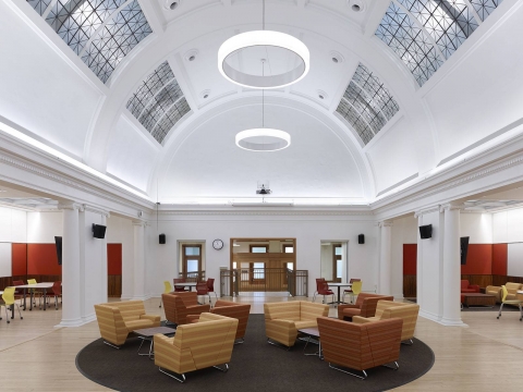 An open atrium space with various couches and seating arrangements.