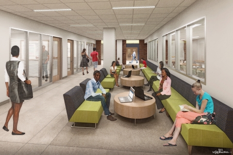 Students studying and relaxing in a lounge area with couches and tables.