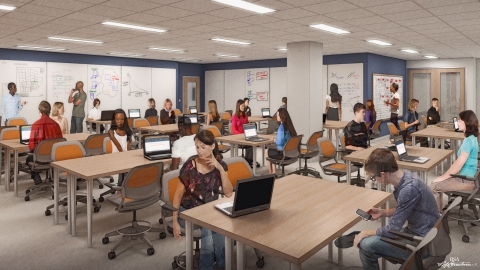 Students working in a classroom at tables with computers and solving problems on wall-mounted white boards.