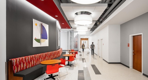 A large hallway entryway with a seating area.