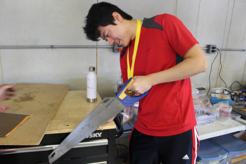 Student Sawing